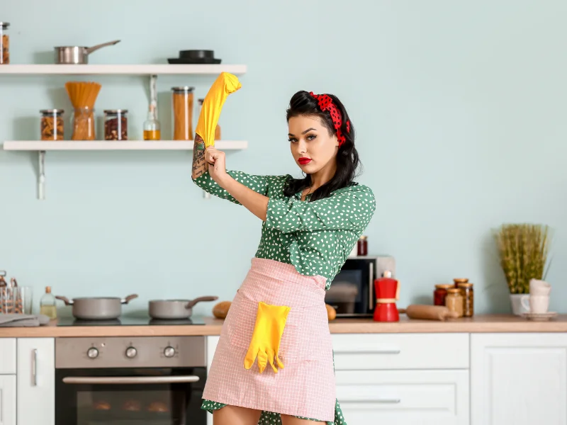 Woman with cleaning gloves on